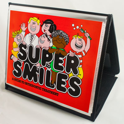 Orthodontic Informational 20 page book - Super Smiles - installed into a binder